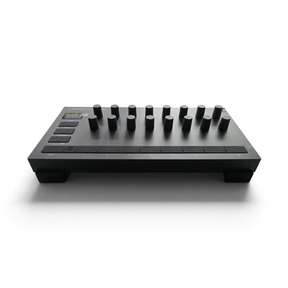 3D printed black stand with raised platform and cylindrical pegs for device controls
